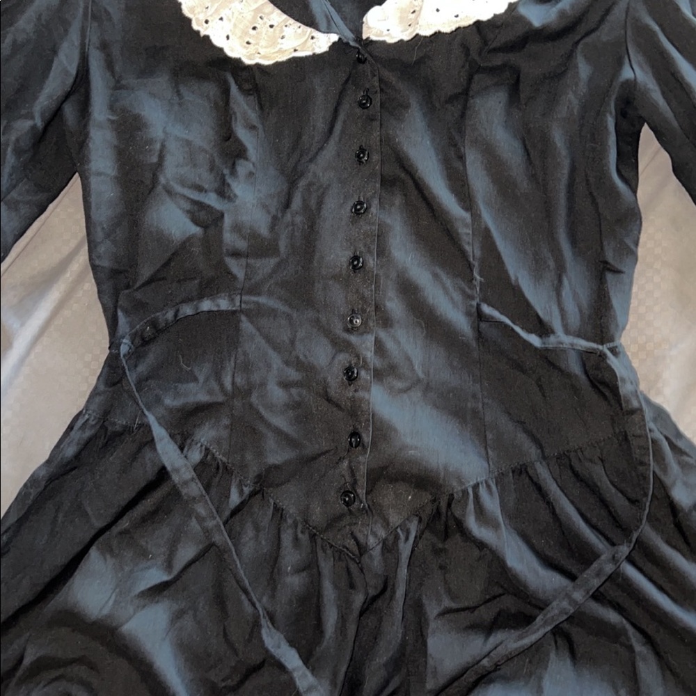 lacy,thin but not see through corset looking dress with buttons and a collar